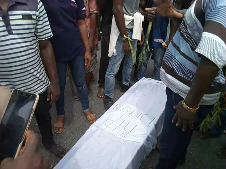 Workers protest against Governor Dickson with a coffin, some fetish items
