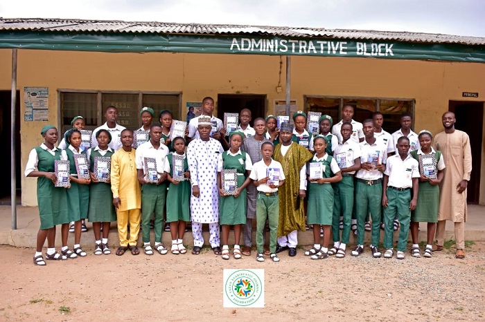 Tazan Foundation Donates educational materials to GSS Ogaminana, in Kogi State