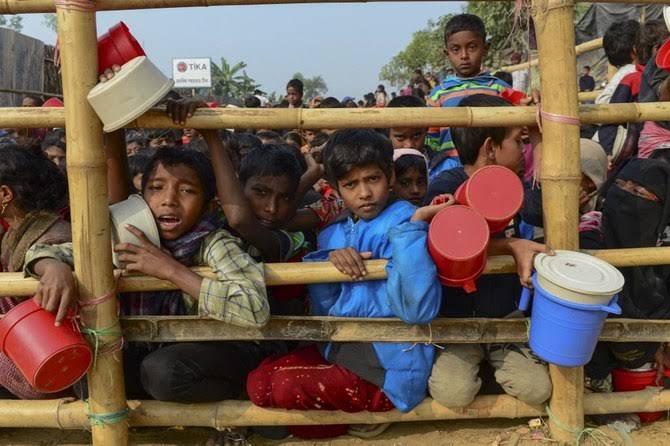 Why is international community responsible to continue the flow of humanitarian assistance for the Rohingyas in Myanmar and Bangladesh?